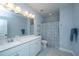 Bathroom featuring a large mirror, vanity, and a tub with a shower curtain at 474 Woodspring Rd, Mount Pleasant, SC 29466