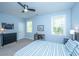 Bright bedroom featuring a ceiling fan, desk near the window, and light blue walls at 474 Woodspring Rd, Mount Pleasant, SC 29466