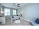 Cozy bedroom with natural light from the windows and neutral decor at 474 Woodspring Rd, Mount Pleasant, SC 29466