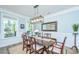 Formal dining room featuring a large table, decorative lighting, and serene paint color at 474 Woodspring Rd, Mount Pleasant, SC 29466