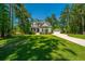 Beautiful two-story home with lush green lawn, detached garage and basketball court at 474 Woodspring Rd, Mount Pleasant, SC 29466