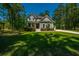 Beautiful two-story home with lush green lawn, detached garage and basketball court at 474 Woodspring Rd, Mount Pleasant, SC 29466