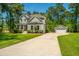 Beautiful two-story home with lush green lawn, detached garage and basketball court at 474 Woodspring Rd, Mount Pleasant, SC 29466