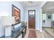Elegant foyer with hardwood floors, a console table, and decorative artwork at 474 Woodspring Rd, Mount Pleasant, SC 29466
