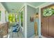 Inviting front porch with seating, a wreath on the door, and a welcome sign at 474 Woodspring Rd, Mount Pleasant, SC 29466