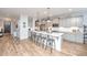 Large open kitchen with stone countertops, island seating, and stainless-steel appliances at 474 Woodspring Rd, Mount Pleasant, SC 29466