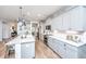 Stylish kitchen with stone countertops, island seating, and stainless-steel appliances at 474 Woodspring Rd, Mount Pleasant, SC 29466