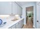 Bright kitchen with white cabinets, subway tile backsplash, and stone countertops at 474 Woodspring Rd, Mount Pleasant, SC 29466