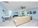 Spacious living area with comfortable seating, a ceiling fan, and a wall-mounted TV at 474 Woodspring Rd, Mount Pleasant, SC 29466