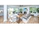 Open living room with hardwood floors, fireplace, and large bright windows at 474 Woodspring Rd, Mount Pleasant, SC 29466