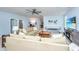 Spacious living area with comfortable seating, a ceiling fan, and a wall-mounted TV at 474 Woodspring Rd, Mount Pleasant, SC 29466