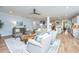 Cozy living room with fireplace and hardwood floors that flows into open concept kitchen at 474 Woodspring Rd, Mount Pleasant, SC 29466