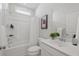 Bright bathroom with a shower-tub combo, white vanity, and neutral decor at 488 Queenview Ln, Charleston, SC 29414