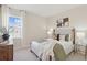Cozy bedroom featuring a large window, a queen size bed, and neutral decor at 488 Queenview Ln, Charleston, SC 29414