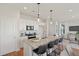 Modern kitchen with white cabinets, granite countertops, stainless steel appliances, and a breakfast bar at 488 Queenview Ln, Charleston, SC 29414