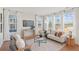 Bright living room featuring large windows, modern furnishings, and a neutral color palette at 488 Queenview Ln, Charleston, SC 29414