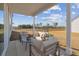 Spacious covered patio with seating area and view of the backyard at 488 Queenview Ln, Charleston, SC 29414