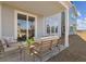 Covered patio with outdoor seating, perfect for relaxing and entertaining at 488 Queenview Ln, Charleston, SC 29414