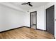 Bright bedroom featuring hardwood floors and an open doorway to a bathroom at 5 Gadsdenboro St # 503, Charleston, SC 29401