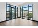 This bedroom features floor to ceiling window views of the surrounding city buildings at 5 Gadsdenboro St # 503, Charleston, SC 29401