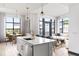 Open concept kitchen features a large island, stainless appliances, and seamless flow to the living area at 5 Gadsdenboro St # 503, Charleston, SC 29401