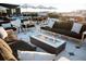 Inviting rooftop lounge area with comfortable seating, a modern glass fire pit, and scenic city views at 5 Gadsdenboro St # 503, Charleston, SC 29401