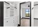 Walk-in closet featuring custom shelving and a glimpse into the bedroom with a park view at 5 Gadsdenboro St # 503, Charleston, SC 29401