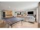 Basement area features tile floors, kitchenette, sofa, and large television at 5 S Basilica Ave, Hanahan, SC 29410