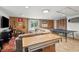 Spacious basement features tile floors, comfortable seating, and ample entertainment options at 5 S Basilica Ave, Hanahan, SC 29410