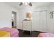 Bright bedroom featuring a closet, dresser with lamp, and hardwood floors at 5 S Basilica Ave, Hanahan, SC 29410