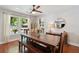 Bright dining room featuring a rustic dining table and a large window overlooking the pool at 5 S Basilica Ave, Hanahan, SC 29410
