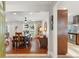 Open dining room featuring hardwood floors, a wooden table set, and views to the pool at 5 S Basilica Ave, Hanahan, SC 29410