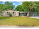 Charming single-story home featuring a brick facade, shutters, and a well-manicured lawn at 5 S Basilica Ave, Hanahan, SC 29410