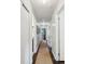 Hallway with hardwood floors, light-colored walls, and access to multiple rooms at 5 S Basilica Ave, Hanahan, SC 29410