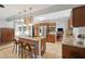 Spacious kitchen with island, granite countertops, stainless appliances, and breakfast bar seating at 5 S Basilica Ave, Hanahan, SC 29410
