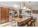 Kitchen with granite counters, stainless appliances, large island with breakfast bar and tiled backsplash at 5 S Basilica Ave, Hanahan, SC 29410