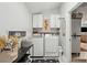 Bright laundry room boasts white cabinets, modern washer and dryer, and stylish decor at 5 S Basilica Ave, Hanahan, SC 29410