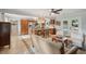 Open-concept living space with a modern kitchen, tile floors, and French doors to the backyard at 5 S Basilica Ave, Hanahan, SC 29410