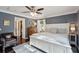 Spacious main bedroom with a king-sized bed, hardwood floors, and an en-suite bathroom at 5 S Basilica Ave, Hanahan, SC 29410