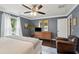 Well-lit main bedroom with hardwood floors, neutral bedding, and ample closet space at 5 S Basilica Ave, Hanahan, SC 29410