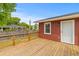 Large wooden back deck with access door, provides a relaxing outdoor space to enjoy the yard at 5163 W Dolphin St, North Charleston, SC 29405