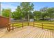 Spacious wooden back deck offers plenty of space for outdoor furniture and overlooks the expansive backyard at 5163 W Dolphin St, North Charleston, SC 29405