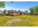 Expansive backyard showcasing mature trees, ideal for outdoor activities and relaxing in a serene setting at 5163 W Dolphin St, North Charleston, SC 29405