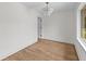 Bright bedroom featuring hardwood floors, white walls and modern lighting at 5163 W Dolphin St, North Charleston, SC 29405