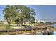 Scenic boardwalk with wooden railings winds along the waterfront with mature trees nearby at 5163 W Dolphin St, North Charleston, SC 29405