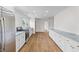 Bright kitchen with white cabinets, stainless appliances, and hardwood floors at 5163 W Dolphin St, North Charleston, SC 29405
