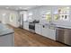 Modern kitchen featuring stainless steel appliances and hardwood floors at 5163 W Dolphin St, North Charleston, SC 29405