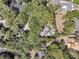 Aerial view of the home featuring mature trees, the backyard pool and new construction nearby at 521 Pelzer Dr, Mount Pleasant, SC 29464