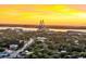 An aerial view of a home near a bridge and a body of water at sunset at 521 Pelzer Dr, Mount Pleasant, SC 29464