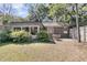 Large backyard with a patio, lush green lawn, and well-maintained landscaping, perfect for outdoor activities at 521 Pelzer Dr, Mount Pleasant, SC 29464